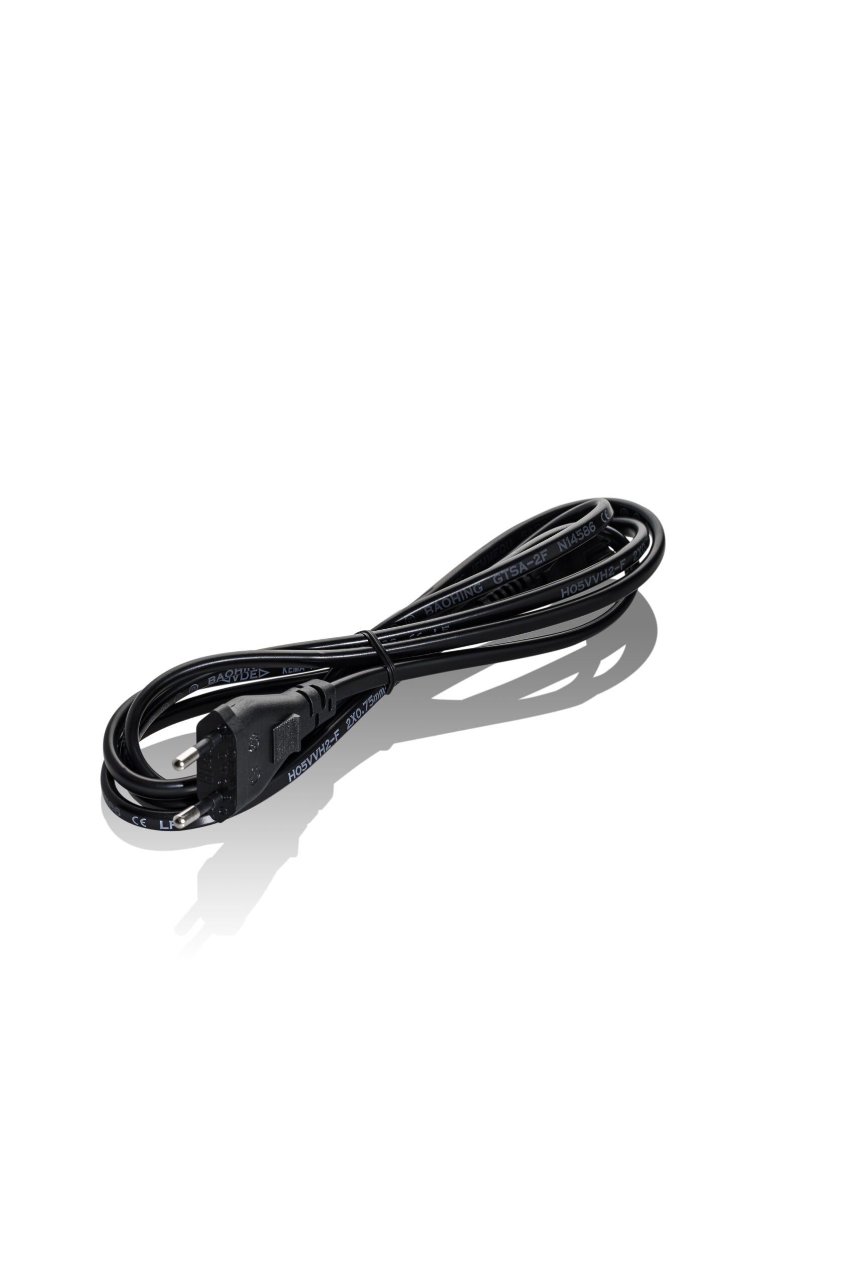 Black two-prong power cable coiled neatly on a white background with a shadow.