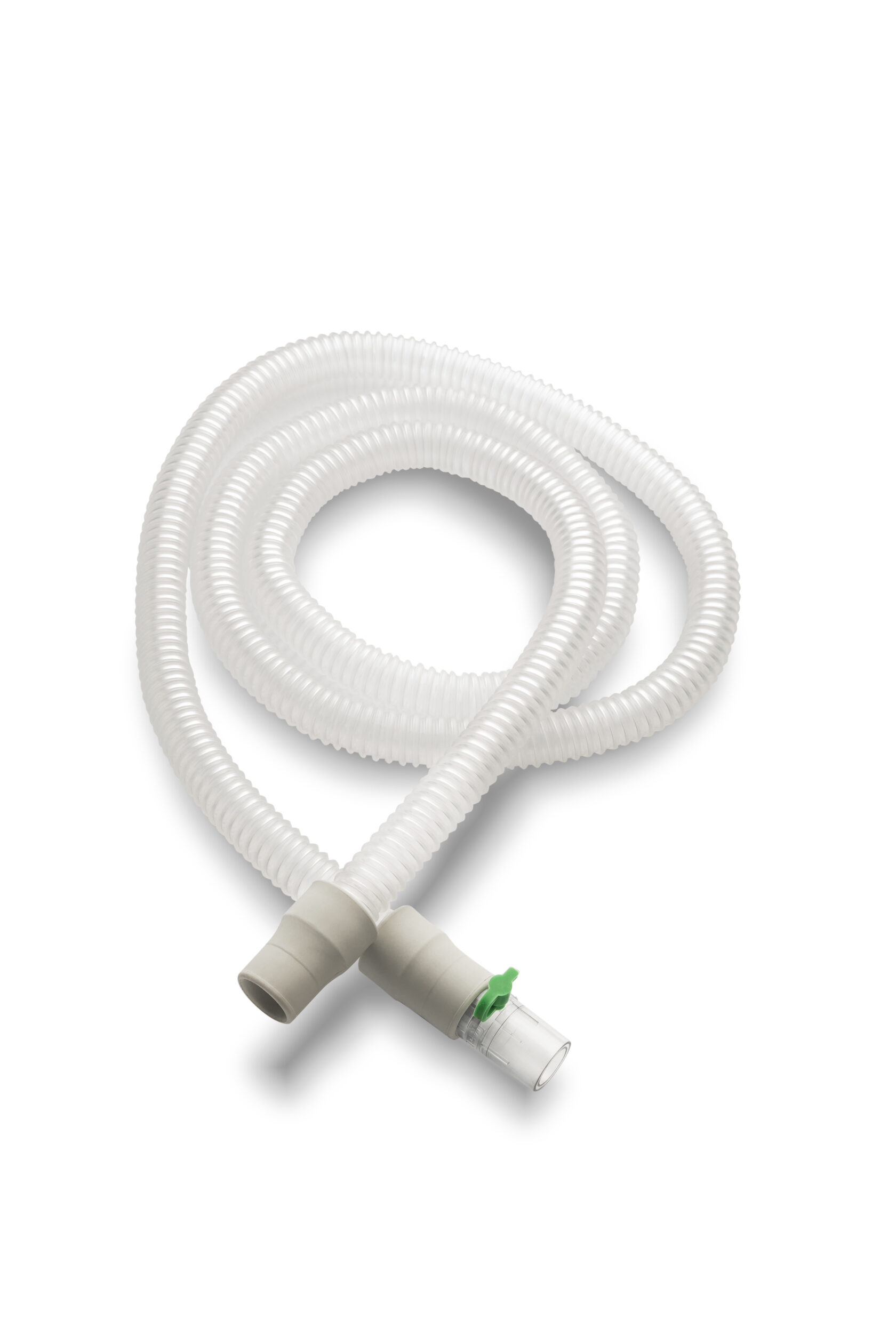 Corrugated white medical breathing tube with plastic connectors on a white background.
