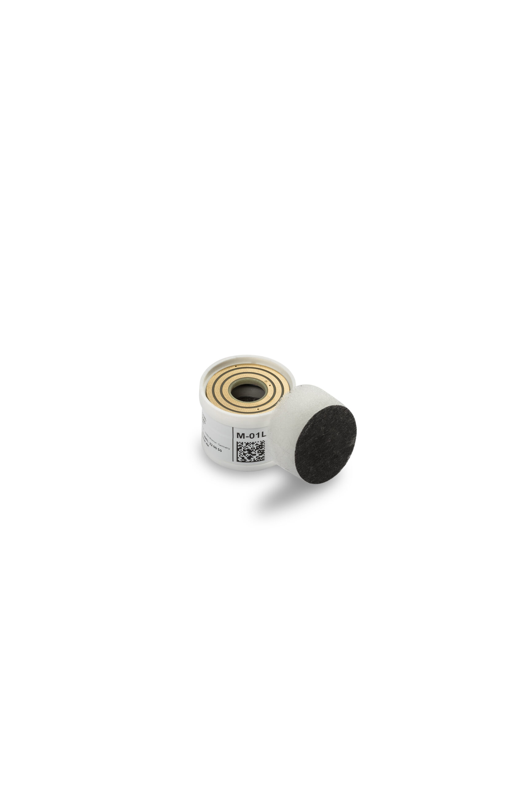 Small white cylindrical sensor with a gold top and QR code, next to a black circular foam filter.