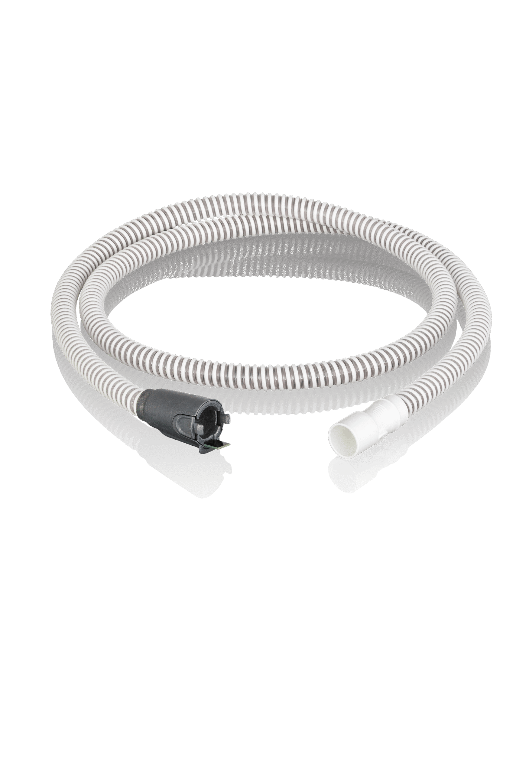 Gray corrugated hose with white and black connectors, coiled on a reflective black surface.