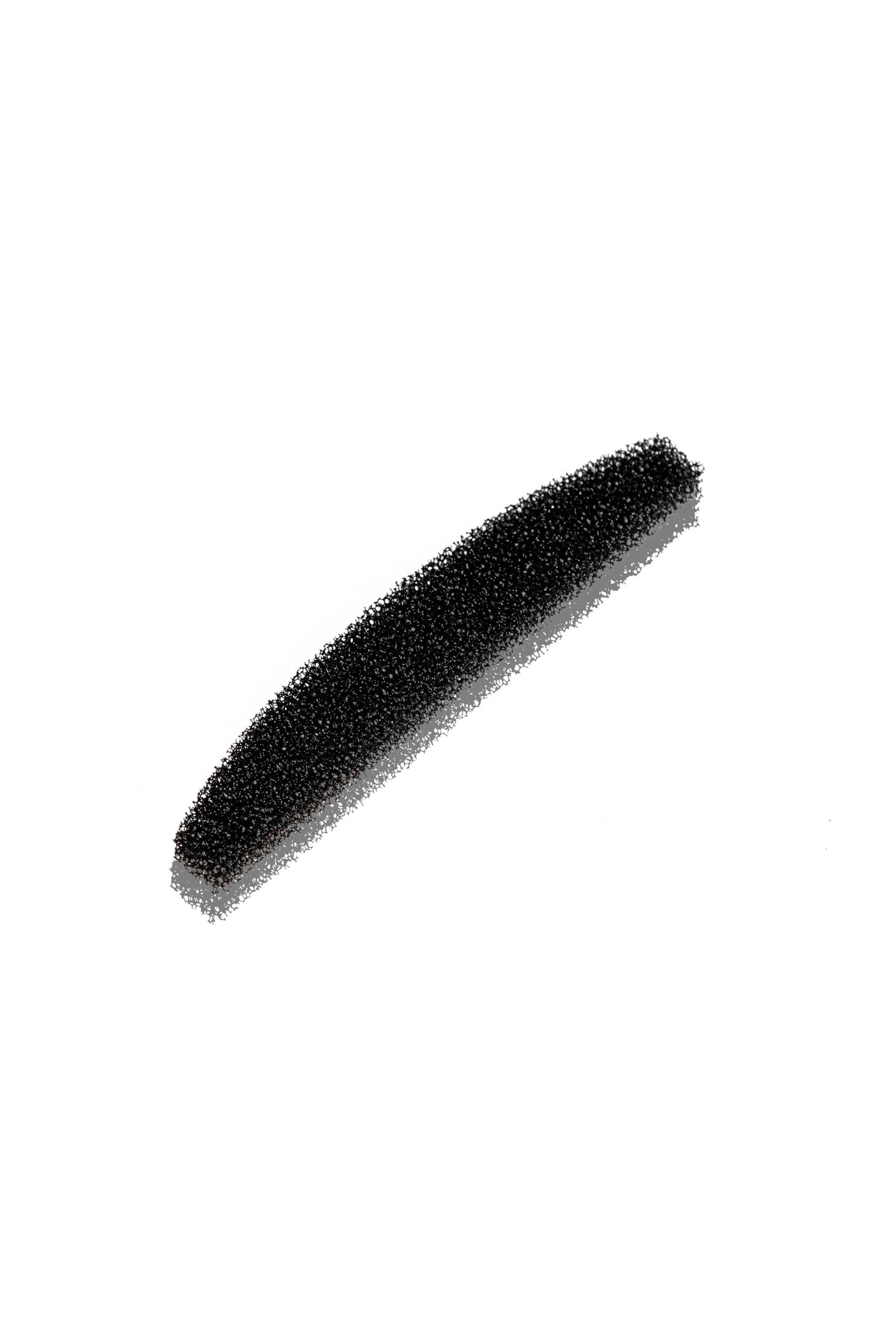 A streak of fine black powder on a black background, forming a thick diagonal line.