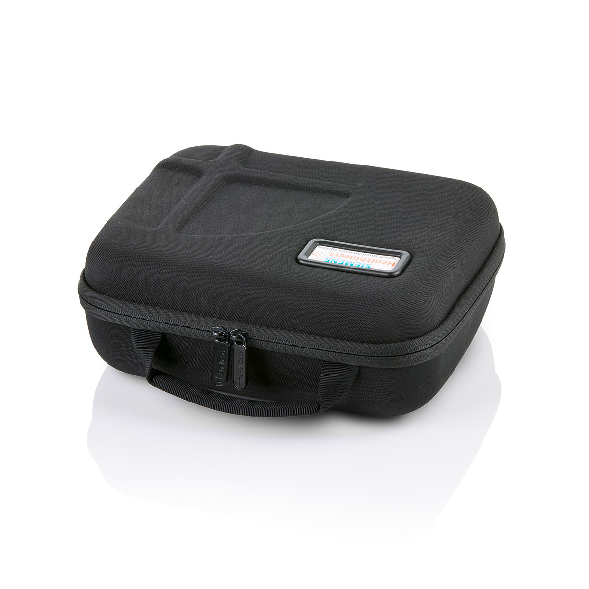 Black rectangular zippered carrying case with a small handle and a label on the lid, photographed on a white background.