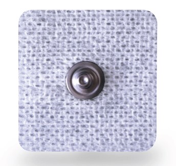 A round metal snap fastener attached to a textured white fabric square.
