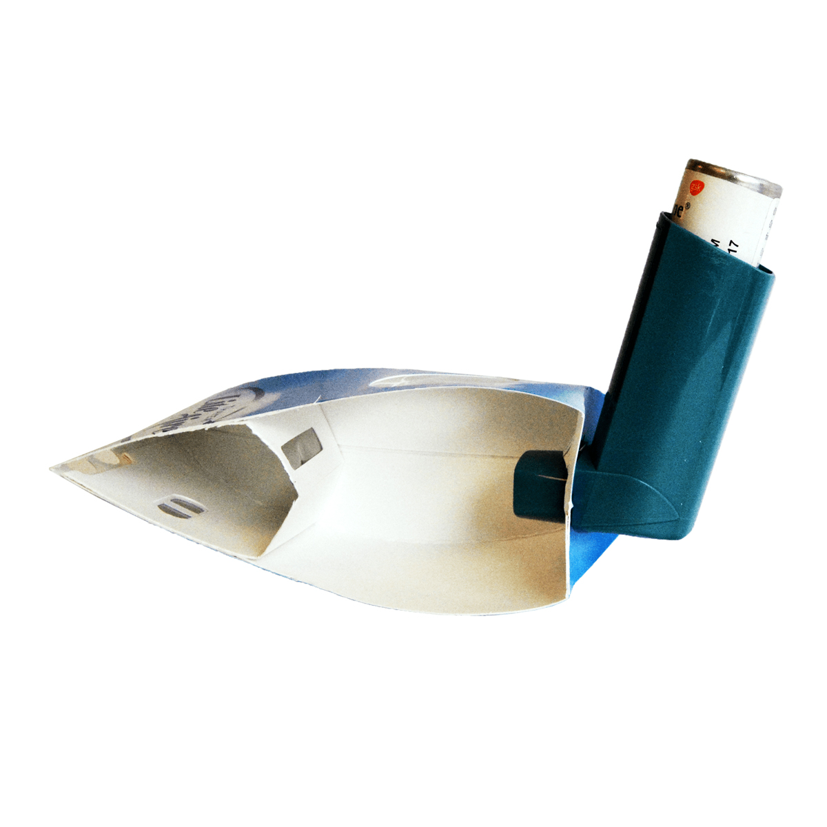 Asthma inhaler attached to a homemade paper spacer, isolated on a white background.