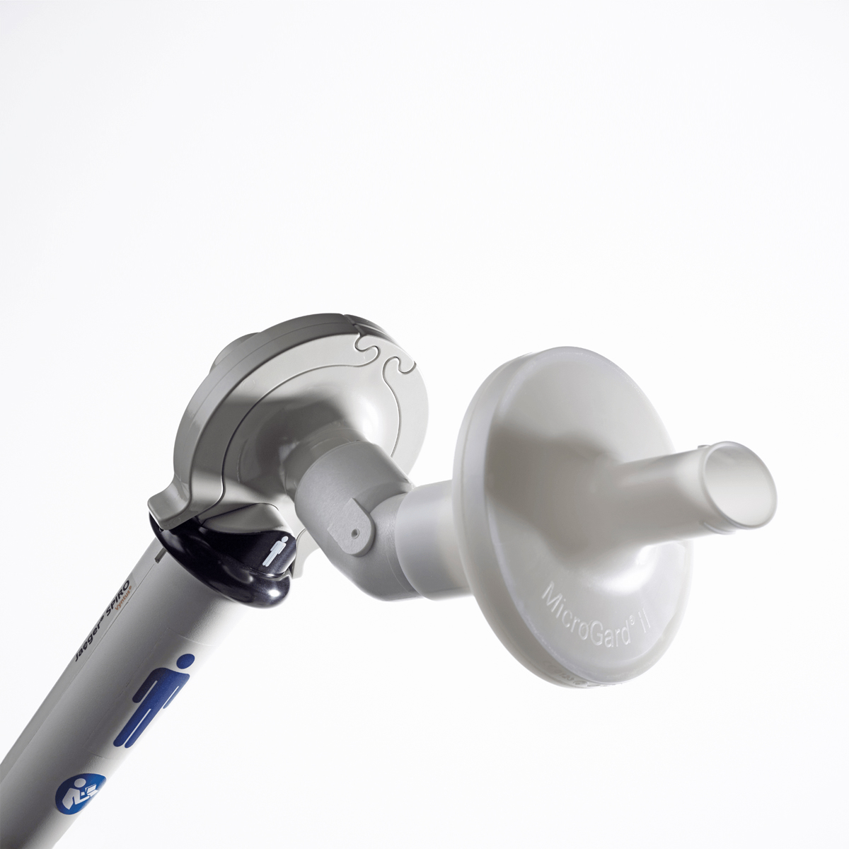 A close-up of a medical spirometer mouthpiece and filter on a white background.