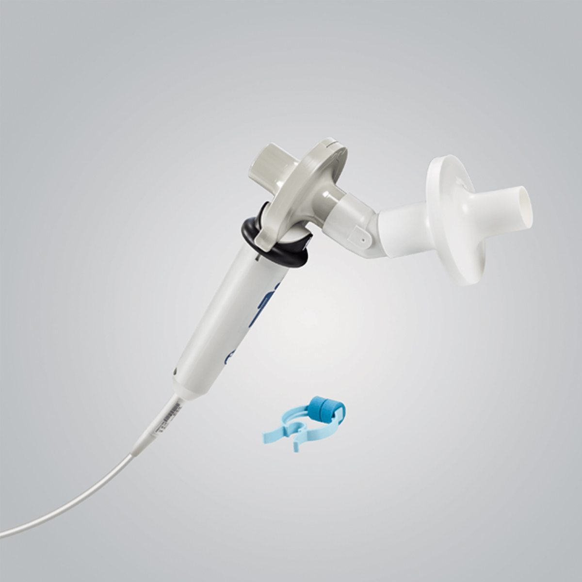 A spirometer breathing device with a mouthpiece and a blue nose clip on a light gray background.