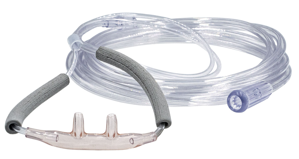 Clear nasal oxygen cannula with attached tubing and foam cushions, used for delivering oxygen to patients.