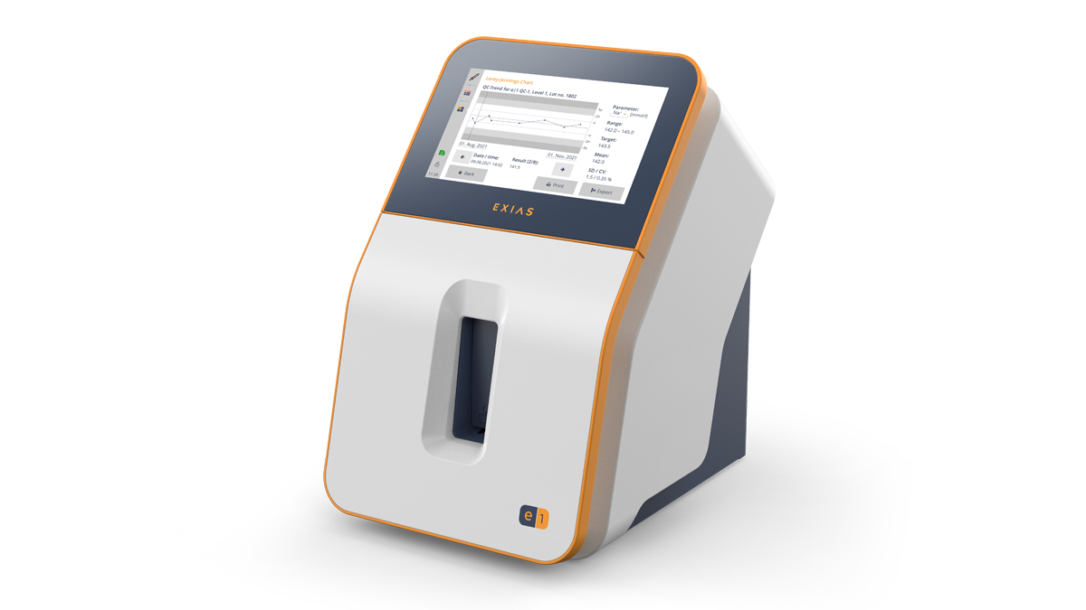 A modern medical device with a touchscreen display showing charts and data, labeled "EXIAS" on the front.