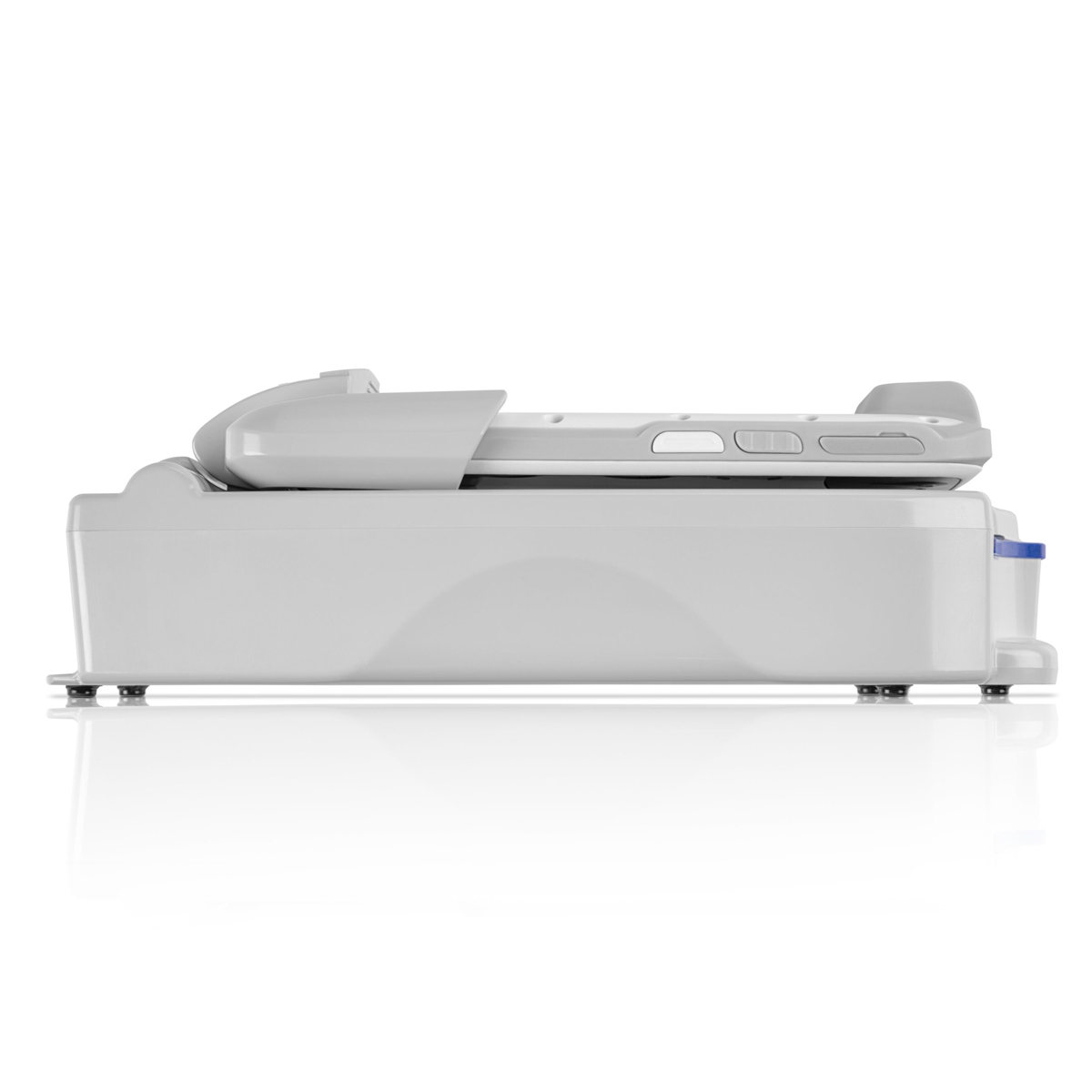 Side view of a modern, gray medical stretcher or hospital bed on a white background.