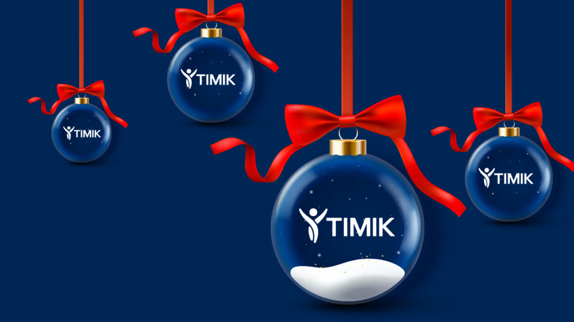 Four blue Christmas ornaments with red bows and "TIMIK" logo hang on a dark blue background.