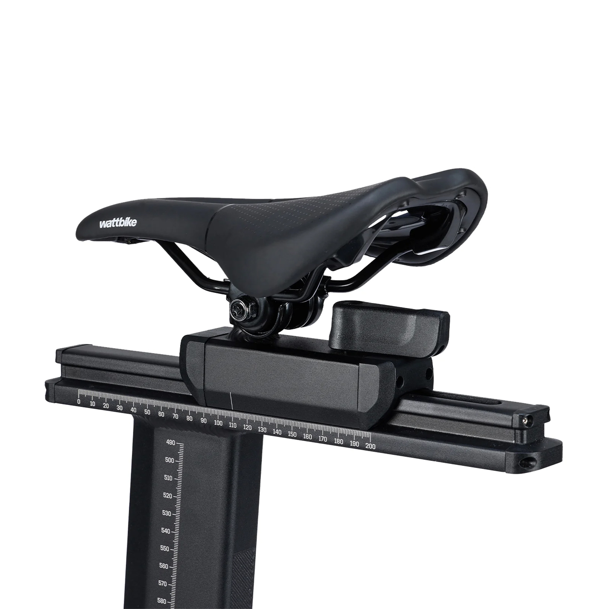 Close-up of a black Wattbike bicycle saddle with seat adjustment mechanism and measurement scales visible.