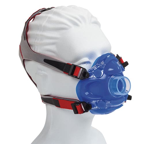 Mannequin head wearing a blue respiratory mask with adjustable red and gray straps.