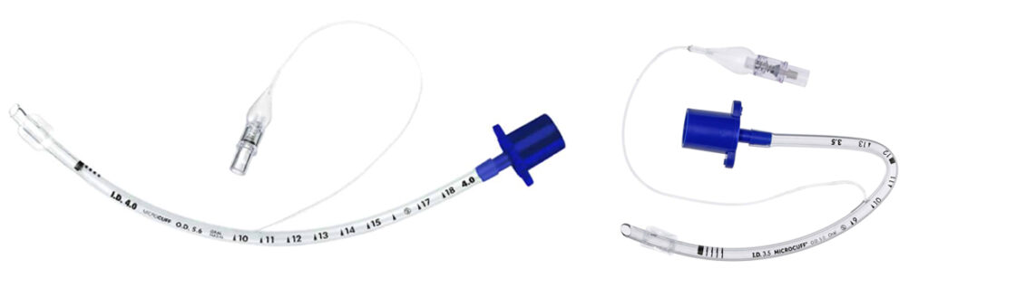 Two clear medical endotracheal tubes with blue connectors, curved and marked with measurement lines.